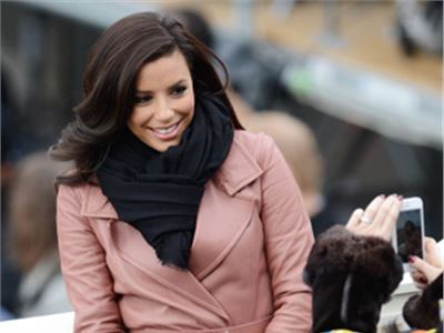 Eva Longoria in antique pink poses for her fans in Washington.
