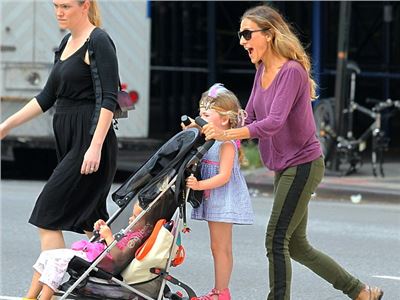 Sarah Jessica Parker  transforms from Fashion Week star to doting mother.
