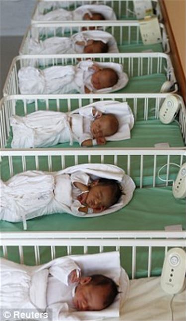 A woman who already had 12 children has given birth to quintuplets after conceiving them naturally.