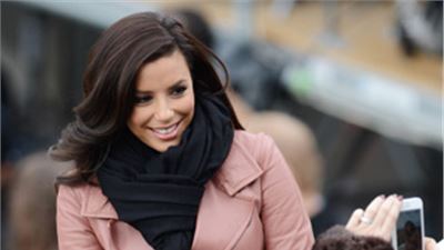 Eva Longoria in antique pink poses for her fans in Washington.