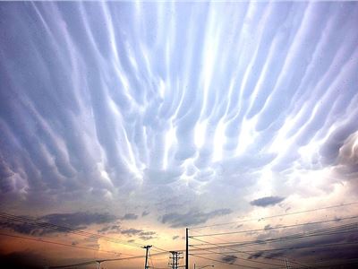 Ripples in the heavens: Glowing 'fingers' appear across a Texan sky as storms sweep the area