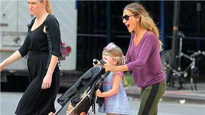 Sarah Jessica Parker  transforms from Fashion Week star to doting mother.
